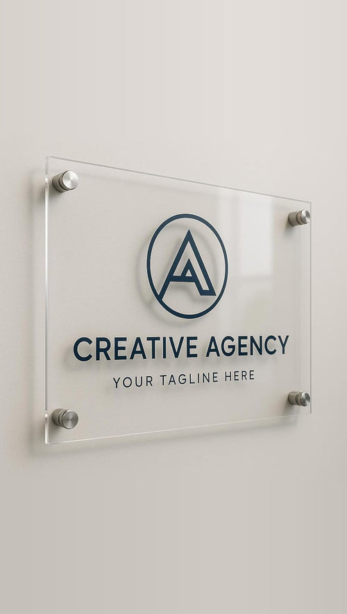 Clear glass-effect acrylic wall plaque on steel standoffs with a sample Creative Agency logo