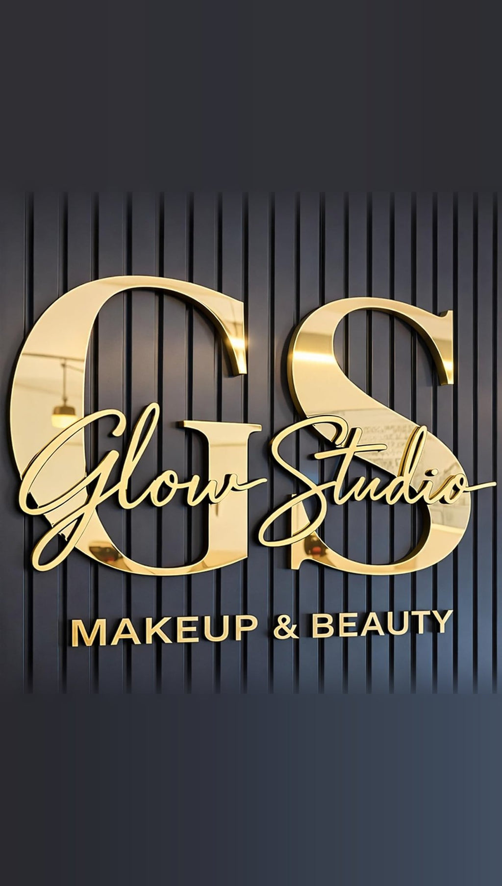 Mirror gold 3D letters reading Glow Studio Makeup & Beauty on a dark slatted wall, sample design