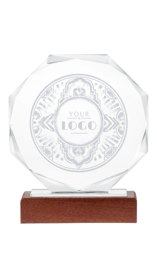 Octagonal crystal award engraved with an Art Deco frame and YOUR LOGO placeholder, on a wooden base