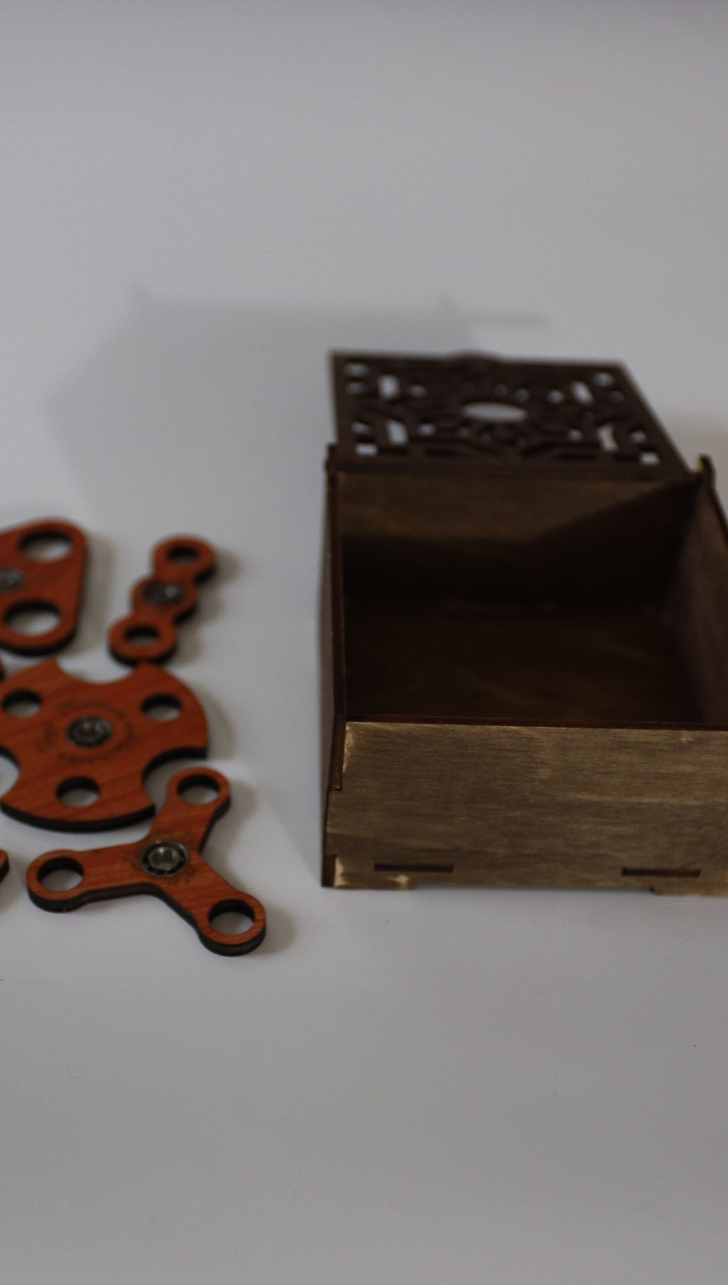 3 mm wooden fidget spinners beside the open box