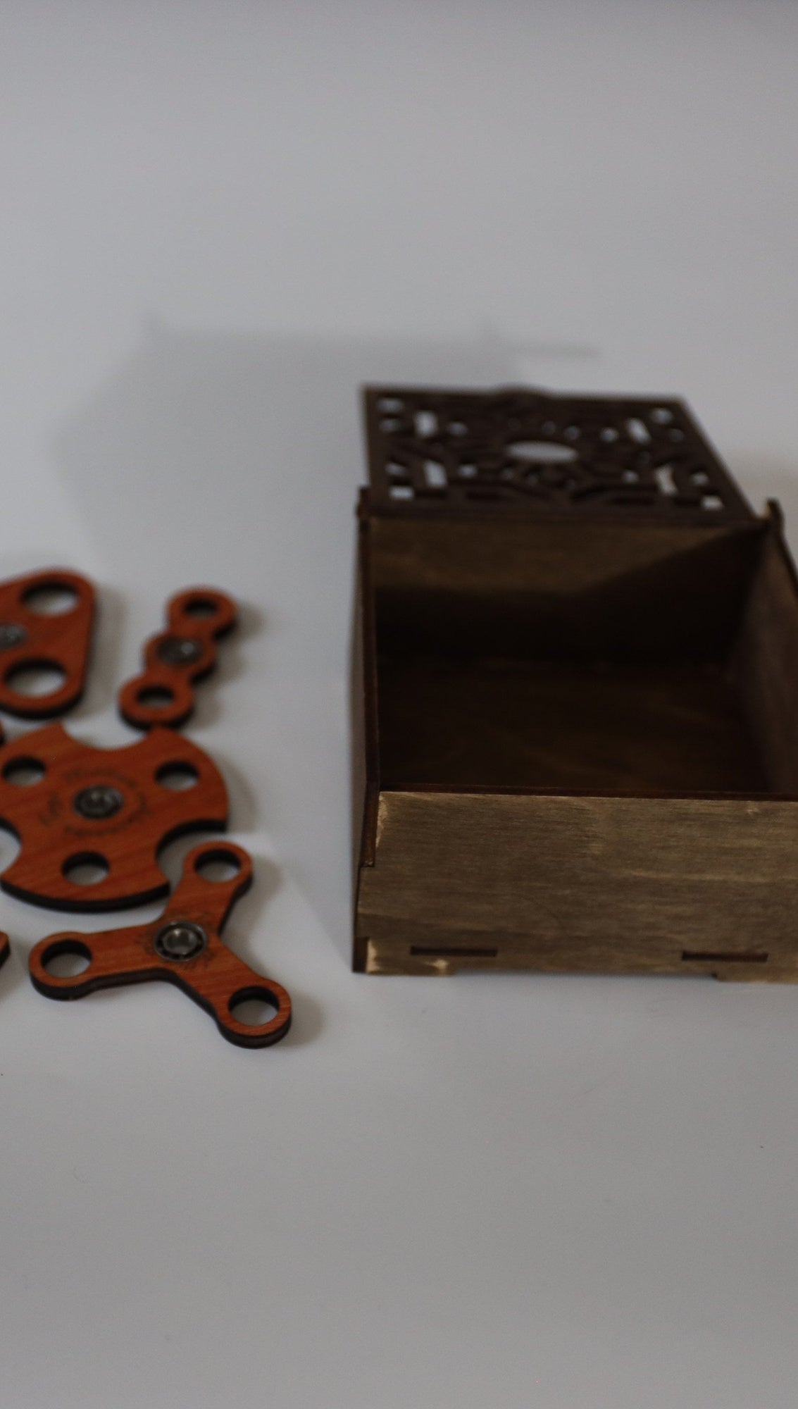 3 mm wooden fidget spinners beside the open box