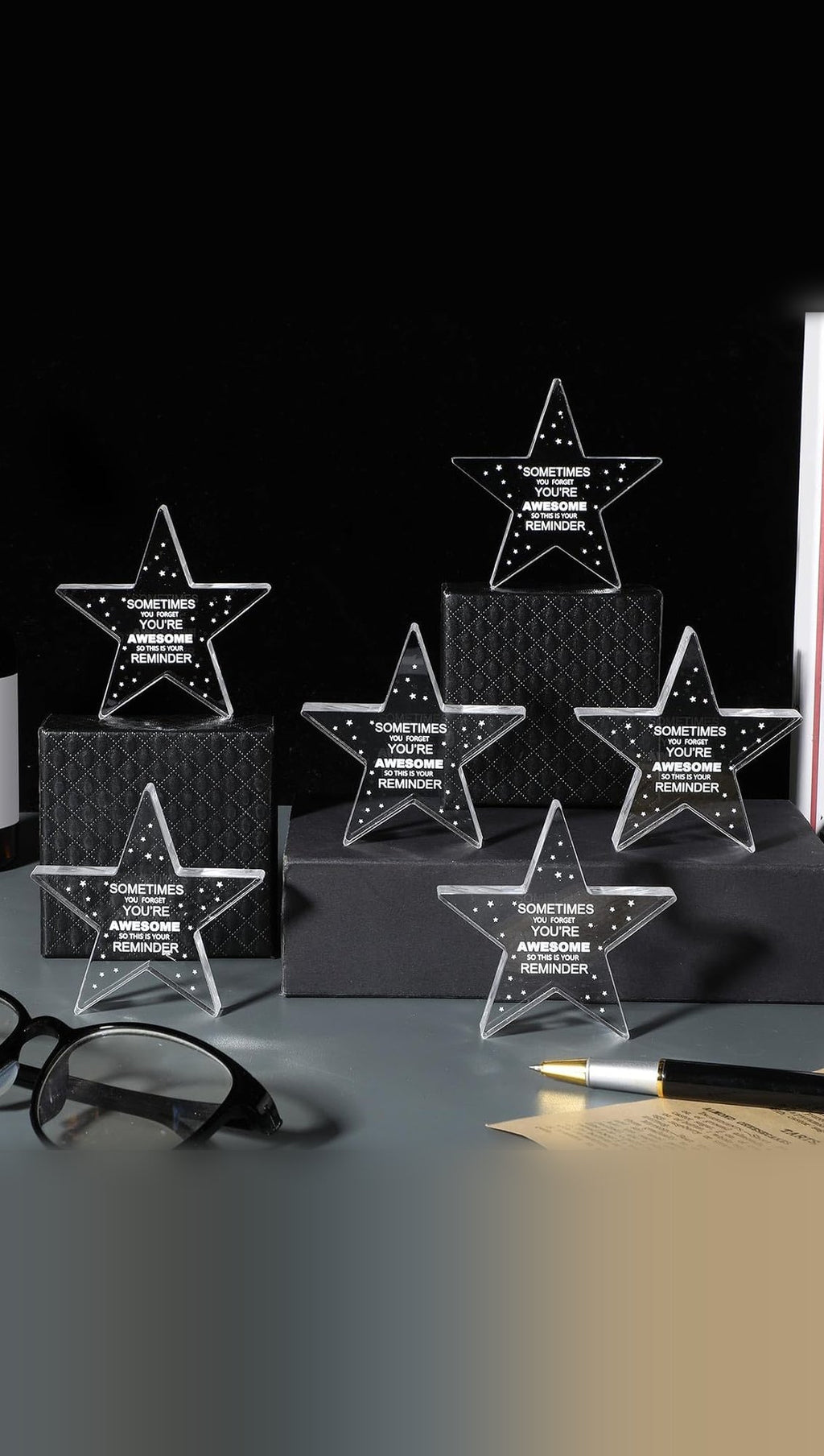 Clear acrylic stars standing upright on a desk display