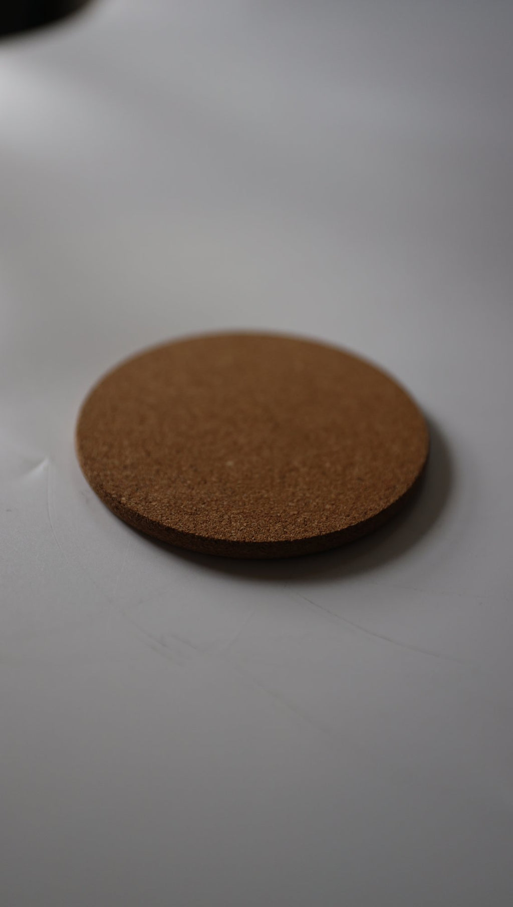 Cork coaster, side view showing thickness