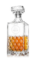 Glass whiskey decanter with stopper and crystal-cut diamond pattern, upper panel with a sample frosted YOUR LOGO engraving