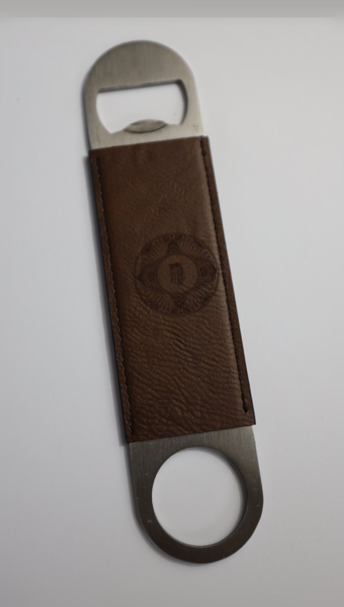 Stainless steel bar blade bottle opener with brown leather sleeve, engraved sample logo