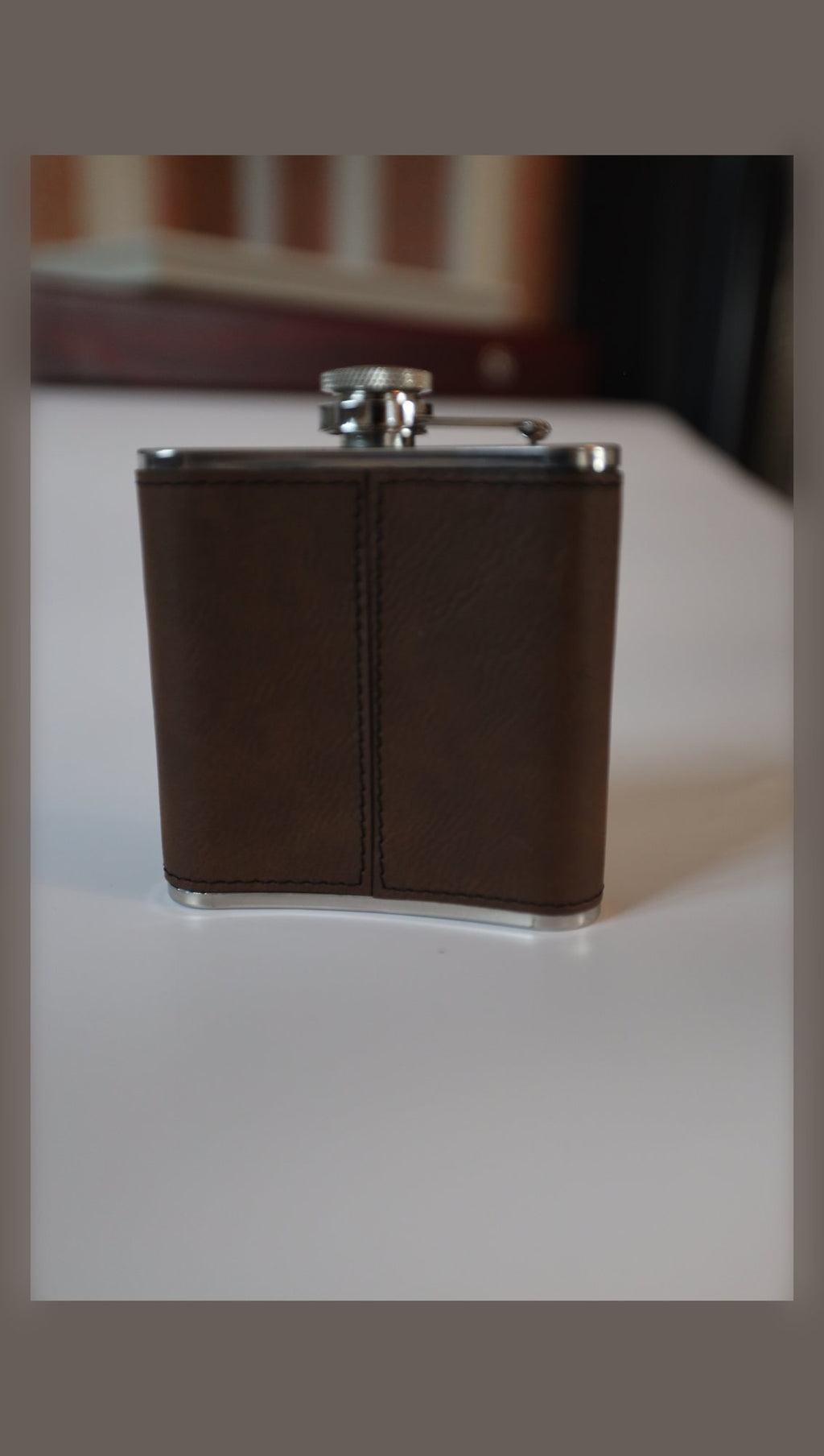 Leather hip flask, plain side view