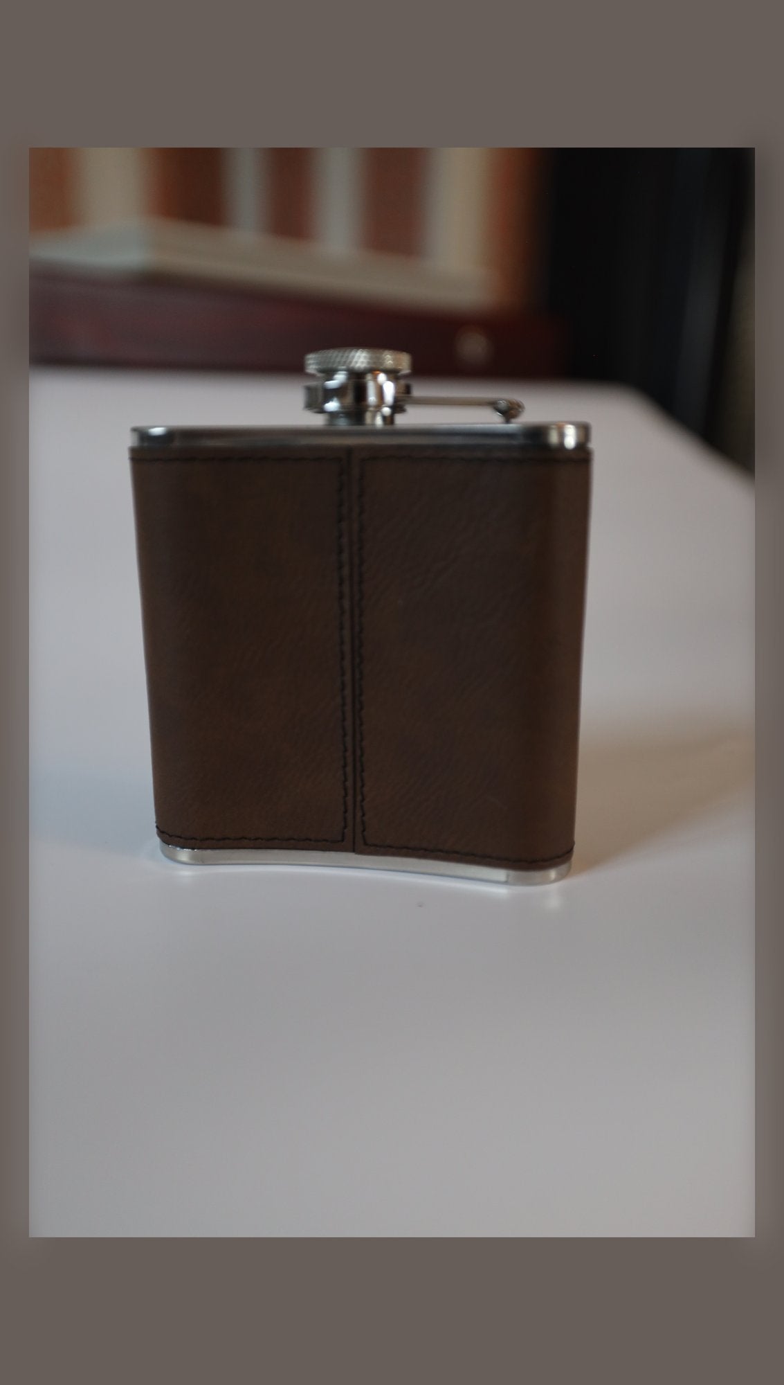 Leather hip flask, plain side view