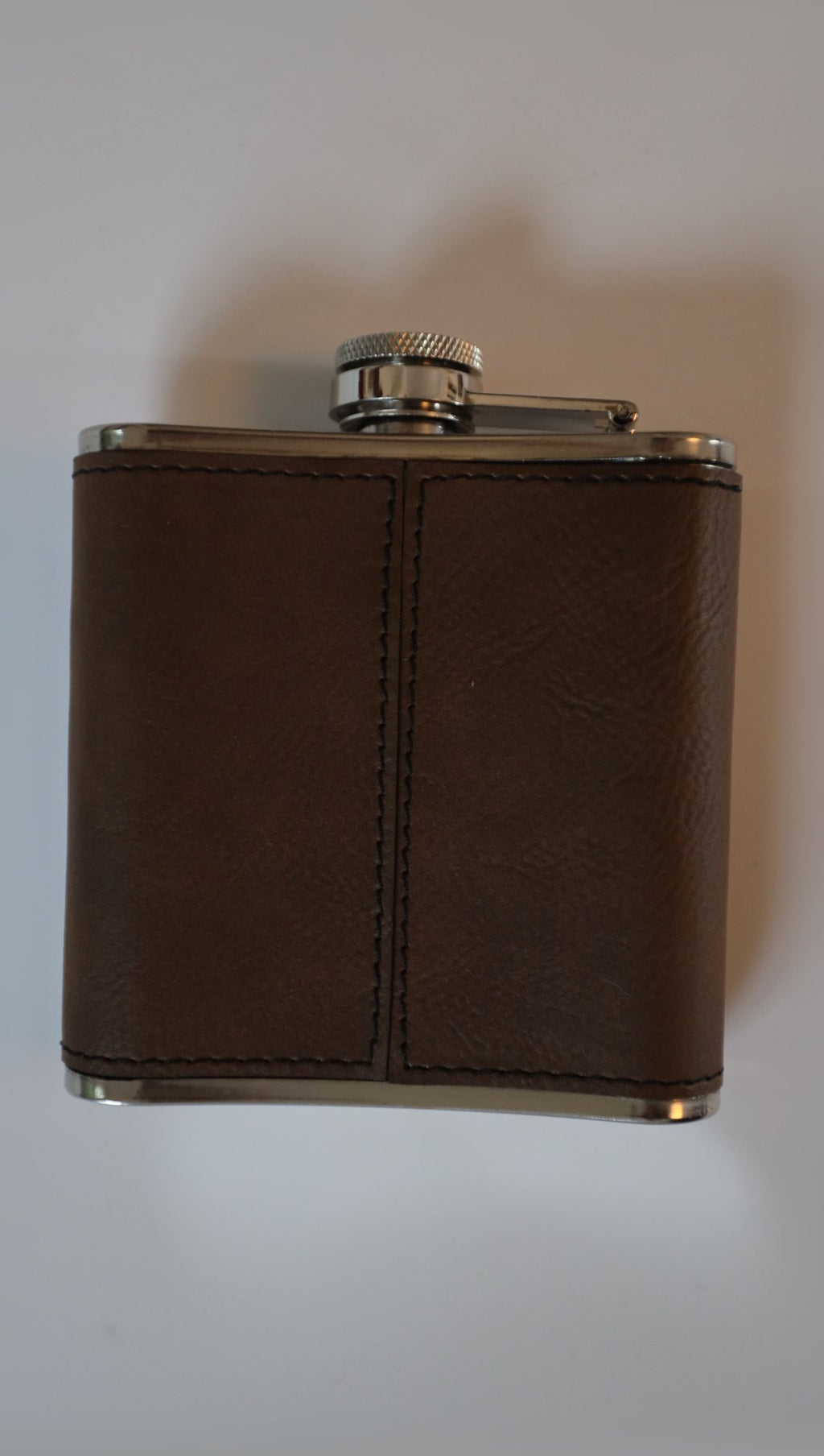 Leather hip flask, reverse side showing stitching