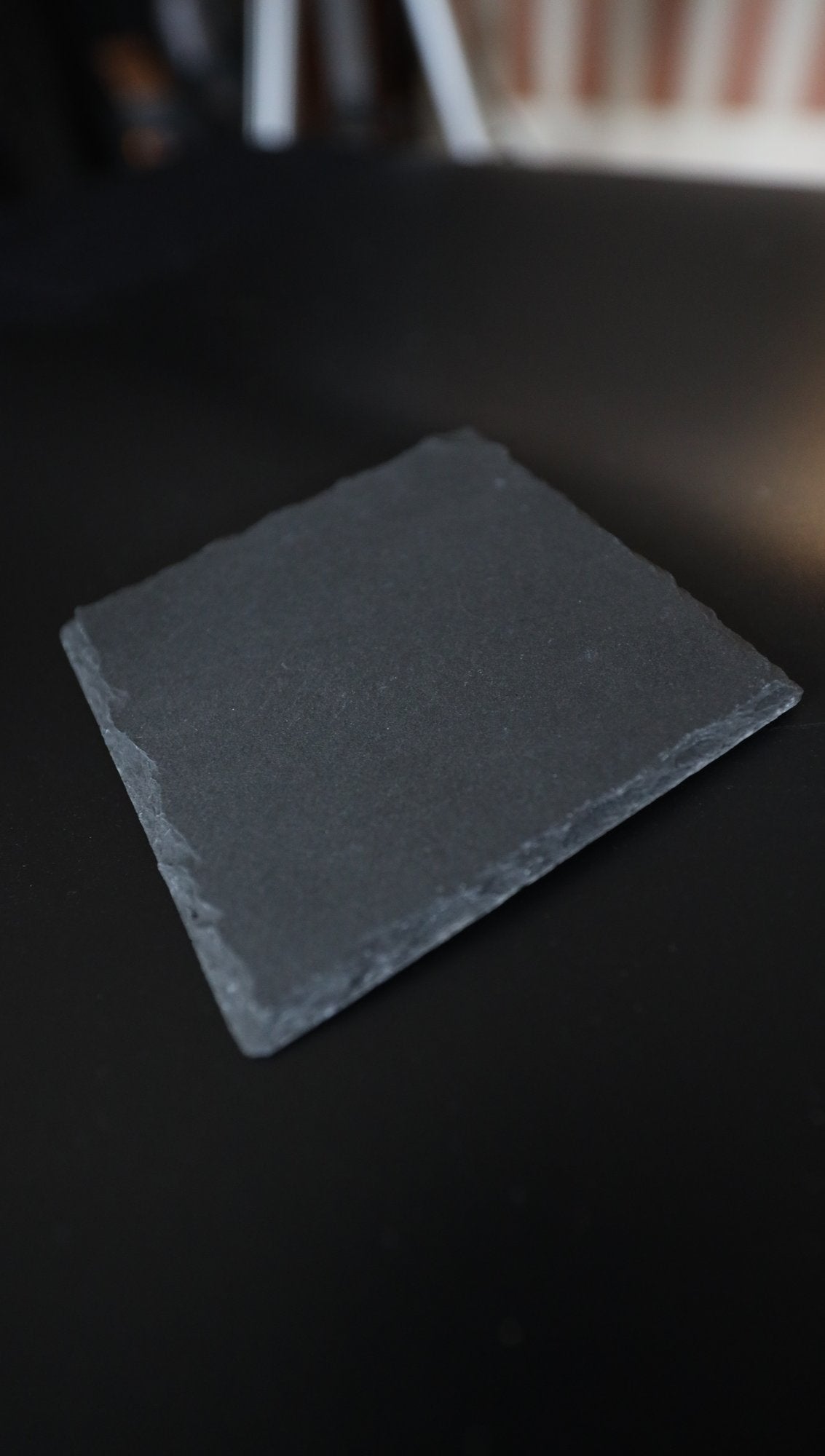 Slate coaster showing natural riven edges