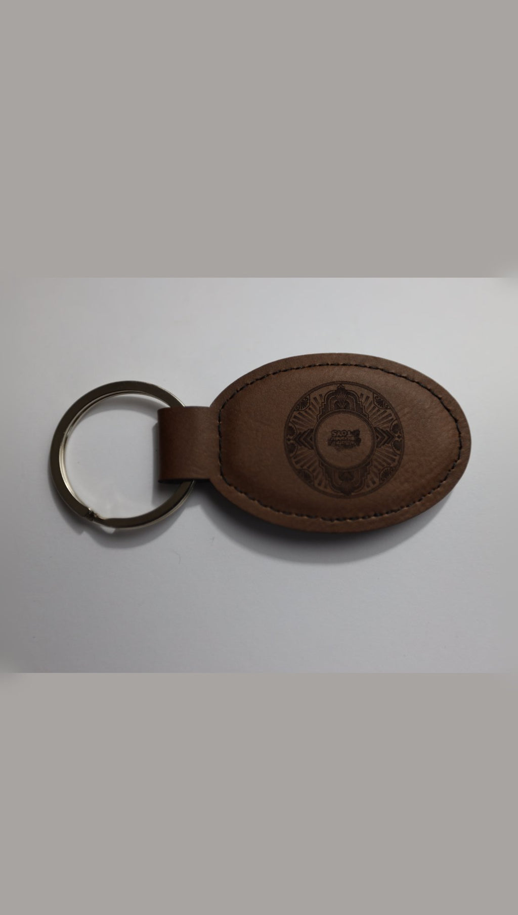 Brown oval faux leather keyring with sample logo engraving