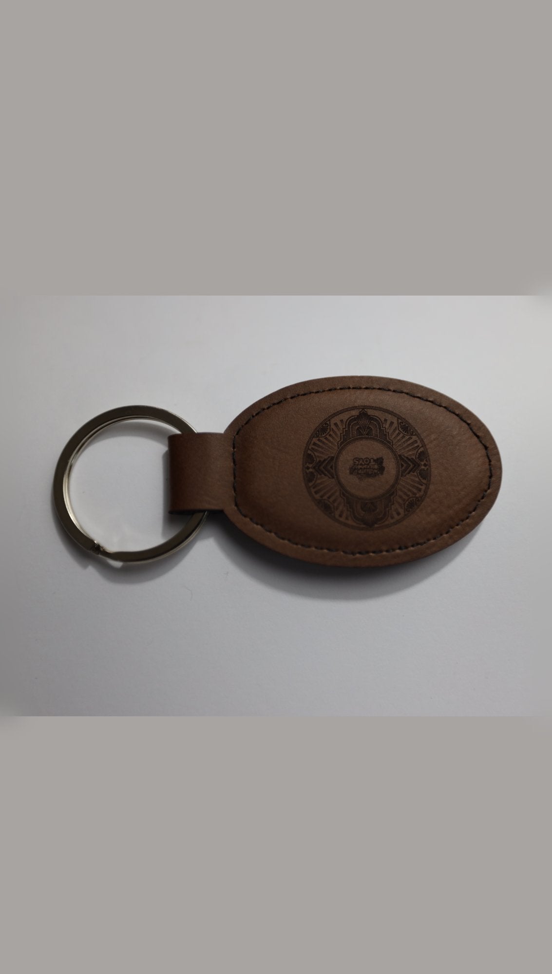 Brown oval faux leather keyring with sample logo engraving