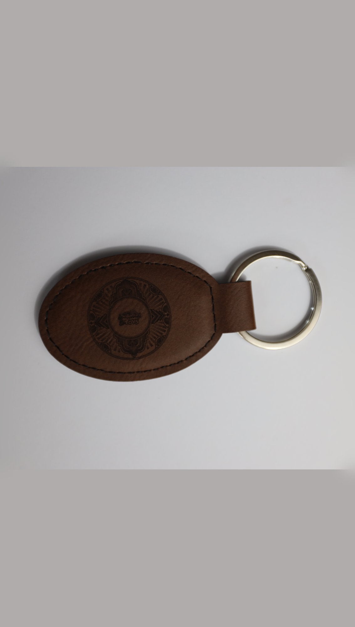 Oval faux leather keyring with sample engraving, alternative angle
