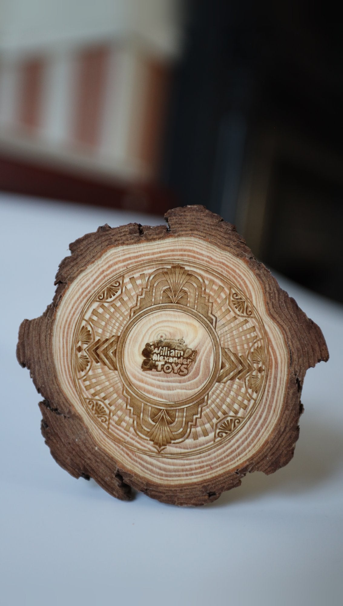 Engraved pine log slice coaster with bark edge