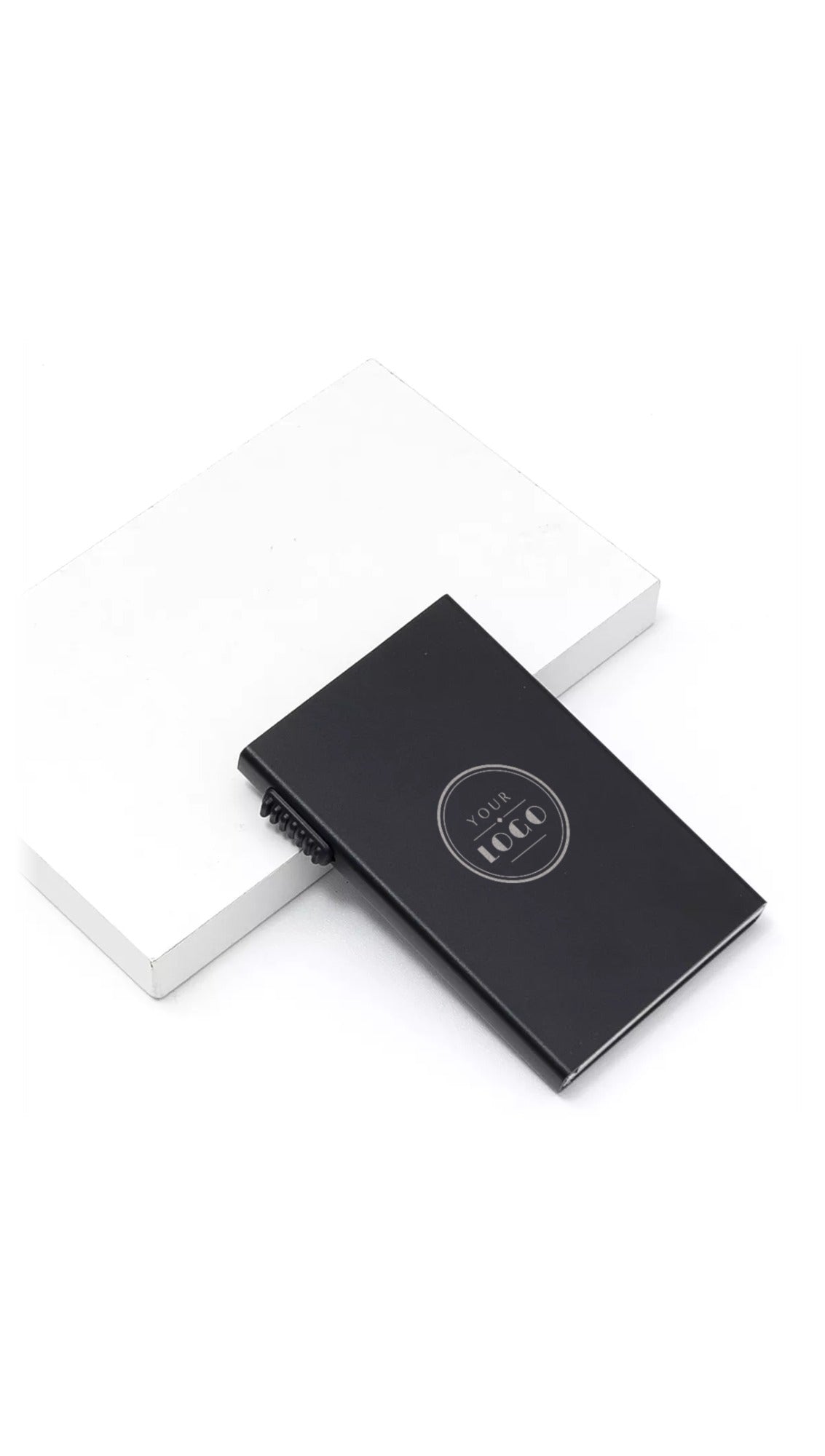Black pop-up metal card holder with sample YOUR LOGO silver laser engraving on the front face