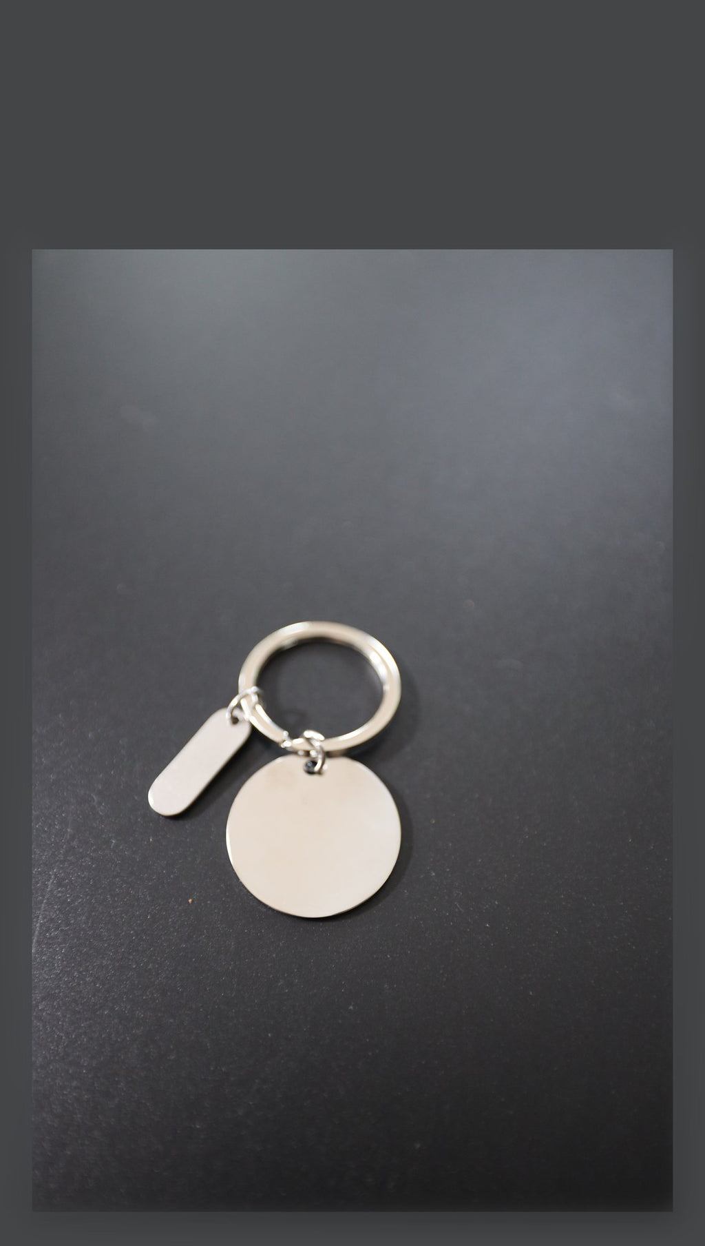 Blank stainless steel disc keyring with tag before engraving