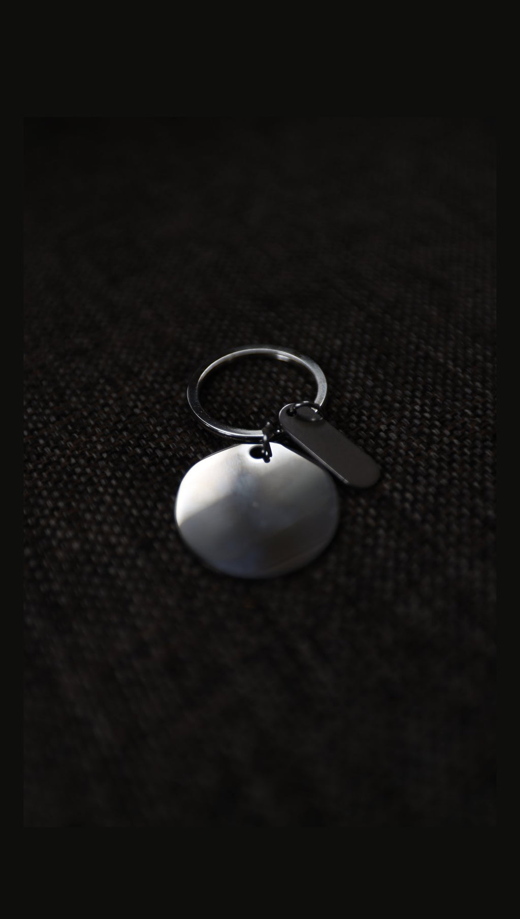 Blank stainless steel disc keyring with tag on fabric