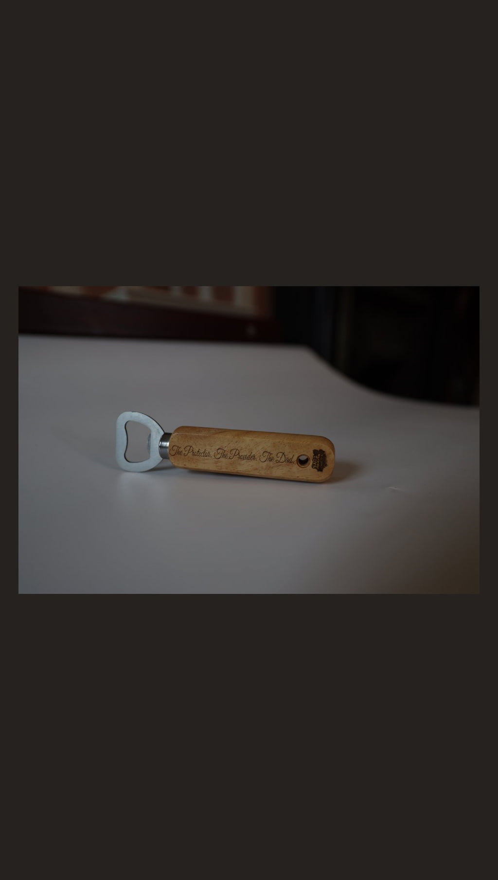 Wooden handle bottle opener with sample engraving, side view