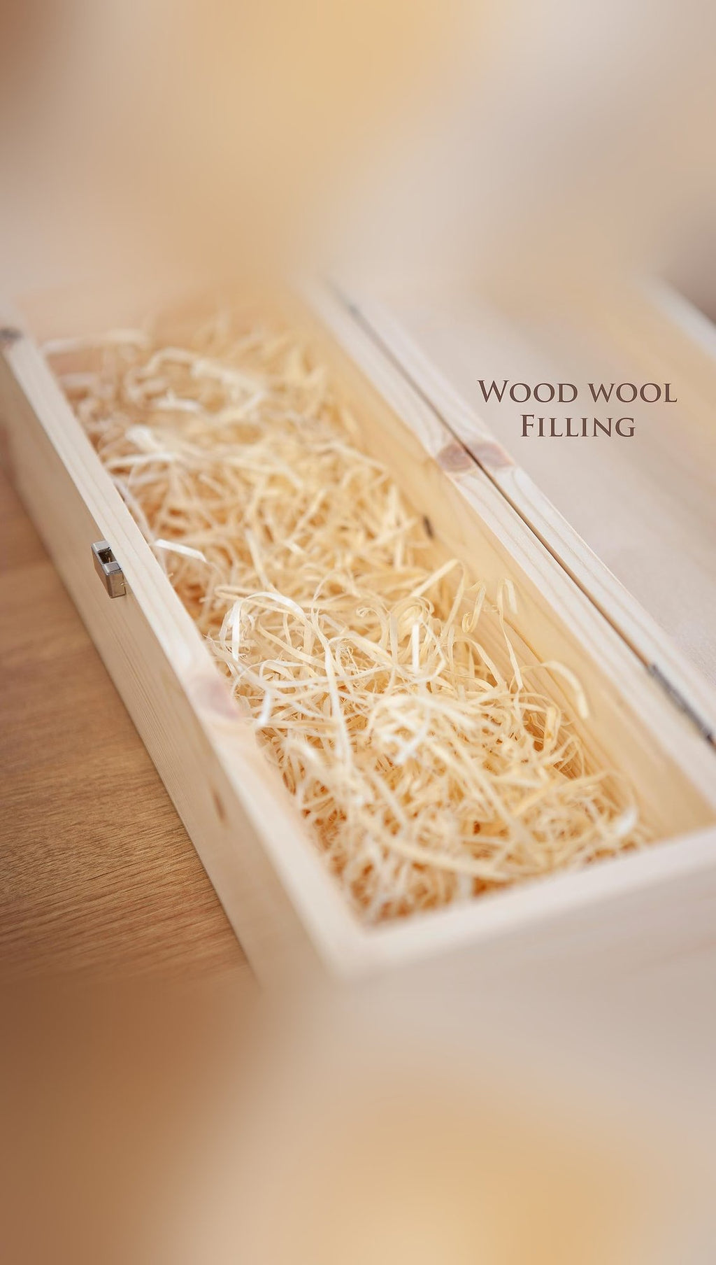 Open pine whisky presentation box with hinged lid and wood wool filling