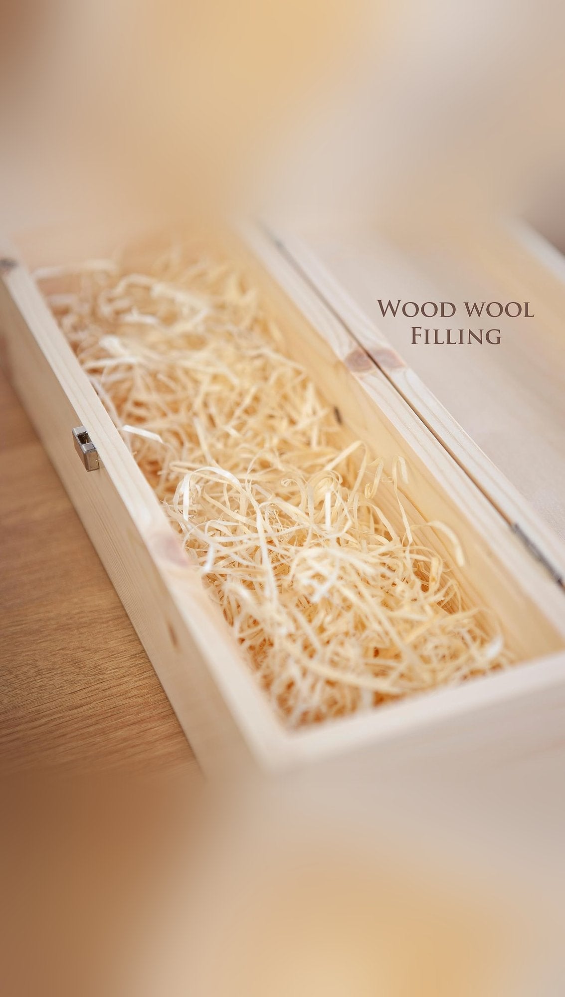Open pine whisky presentation box with hinged lid and wood wool filling