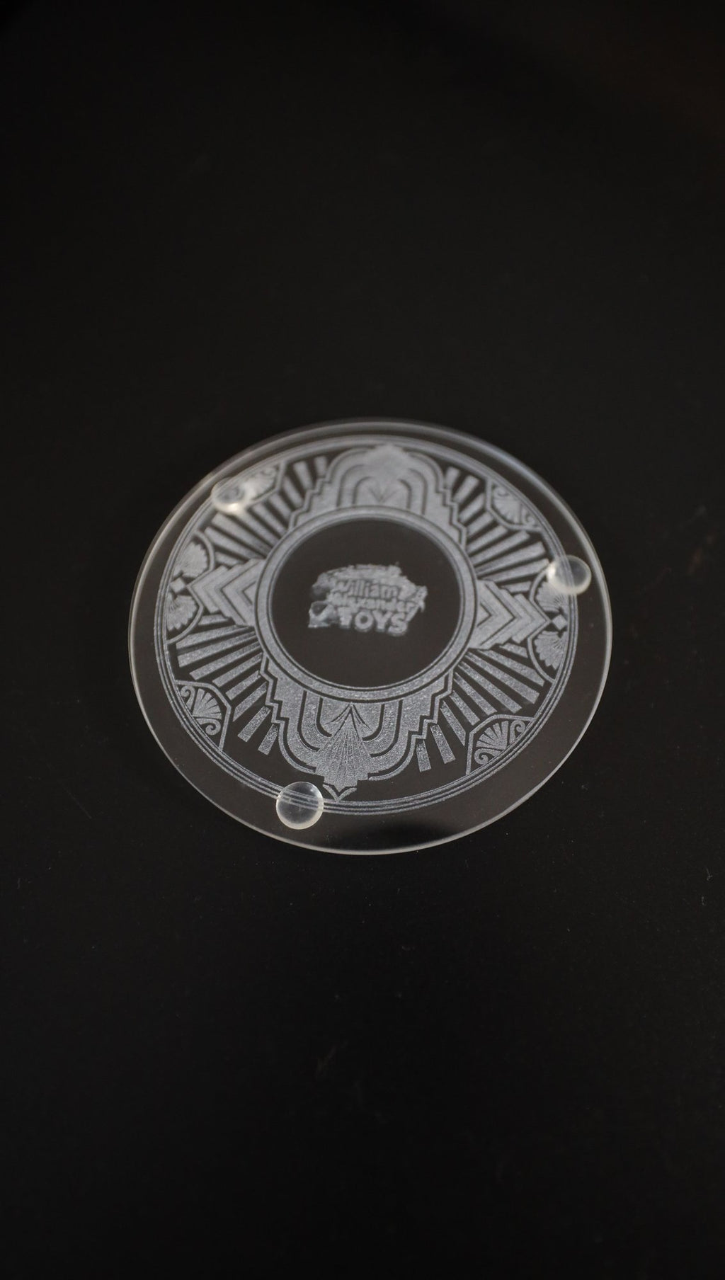 Etched glass coaster with Art Deco design