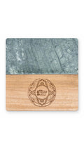 Square marble and wood coaster with an engraved logo on the wood half