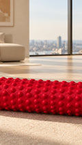 Red massage roller, shown full length