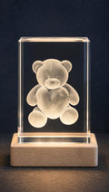 K9 crystal photo block with a 3D-engraved design, lit on a wooden LED base